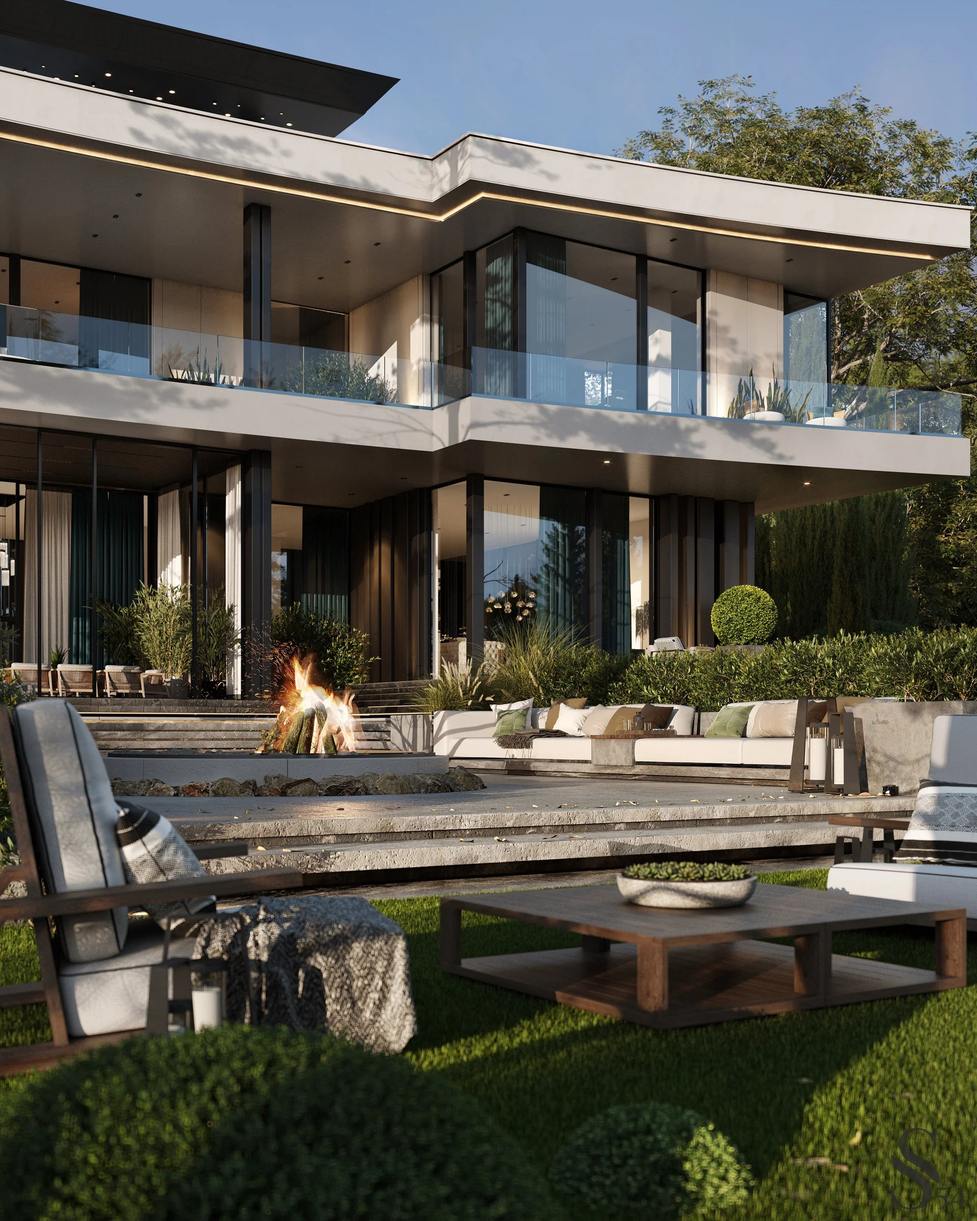 The soft seating area with a fireplace on the terrace is a delightful space to spend time, enjoying the view of the pine groves.