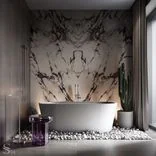 The marble slab, brought from Italy and manually selected by Studia 54, is meticulously arranged in a captivating butterfly layout